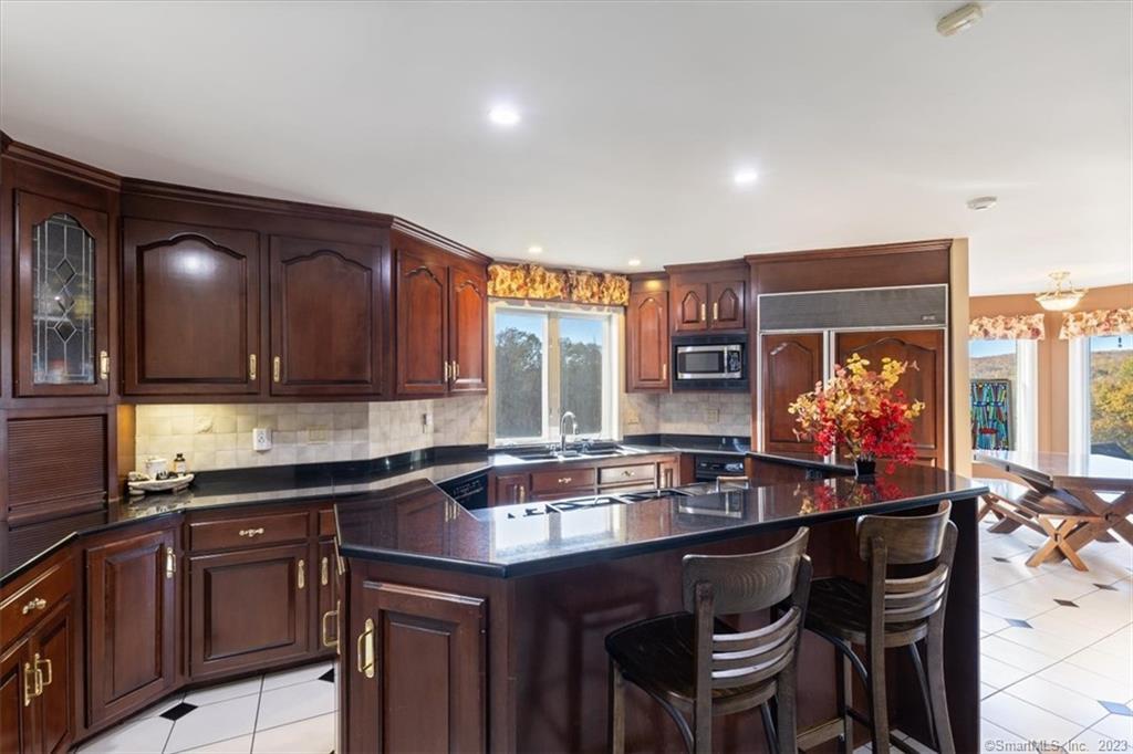 195 Injun Hollow Road Haddam, CT 06424 - Photo 17 of 40 Kitchen with Granite and custom refrigerator