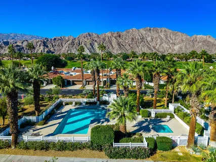 a aerial view of a house with a yard