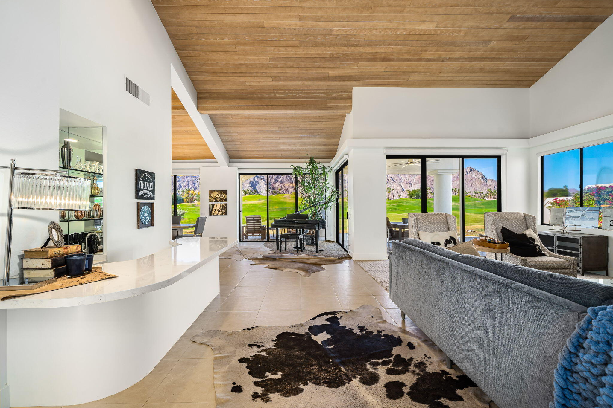 54885 Inverness Way La Quinta, CA 92253 - Photo 20 of 53 a living room with furniture and a large window