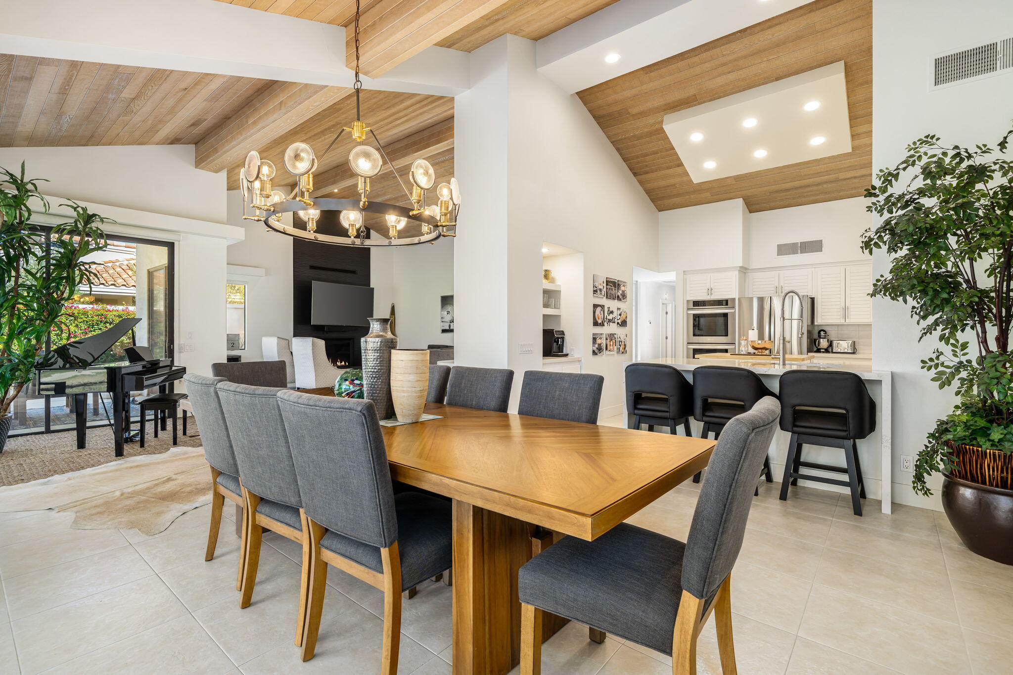 54885 Inverness Way La Quinta, CA 92253 - Photo 31 of 53 a view of a dining room with furniture and chandelier