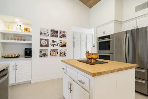 a view of a living room and kitchen