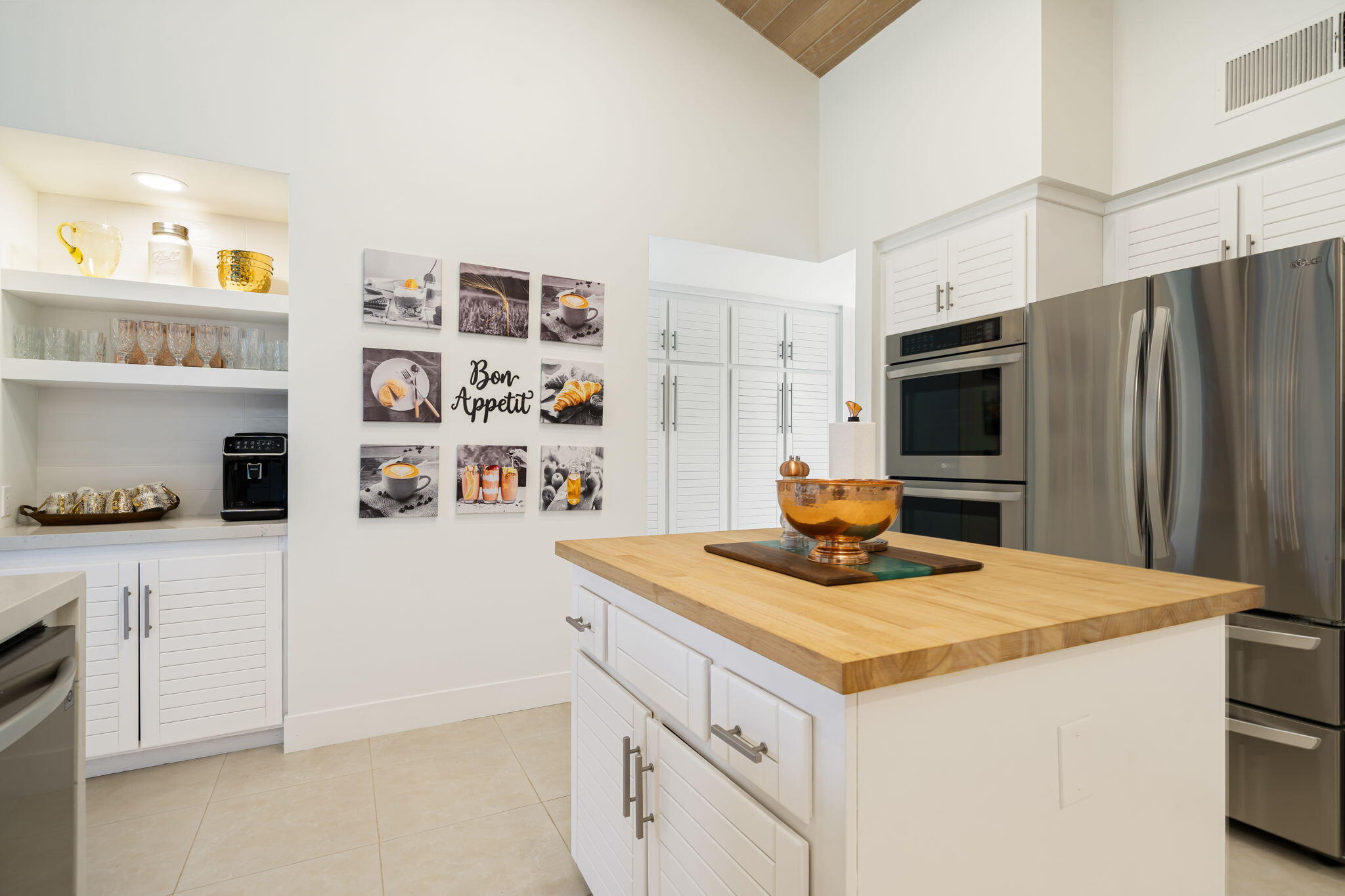 54885 Inverness Way La Quinta, CA 92253 - Photo 38 of 53 a kitchen with stainless steel appliances granite countertop a sink and a refrigerator