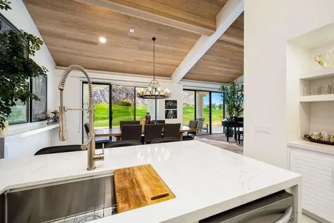 a spacious bedroom with a bed and a couch