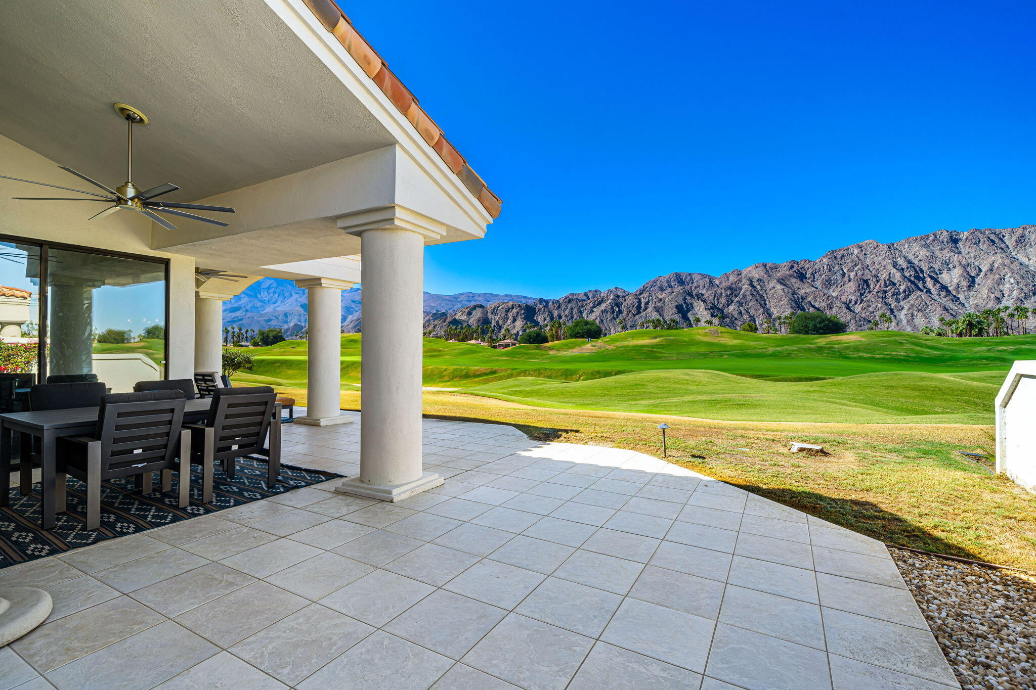 54885 Inverness Way La Quinta, CA 92253 - Photo 4 of 53 a view of a house with a porch and furniture