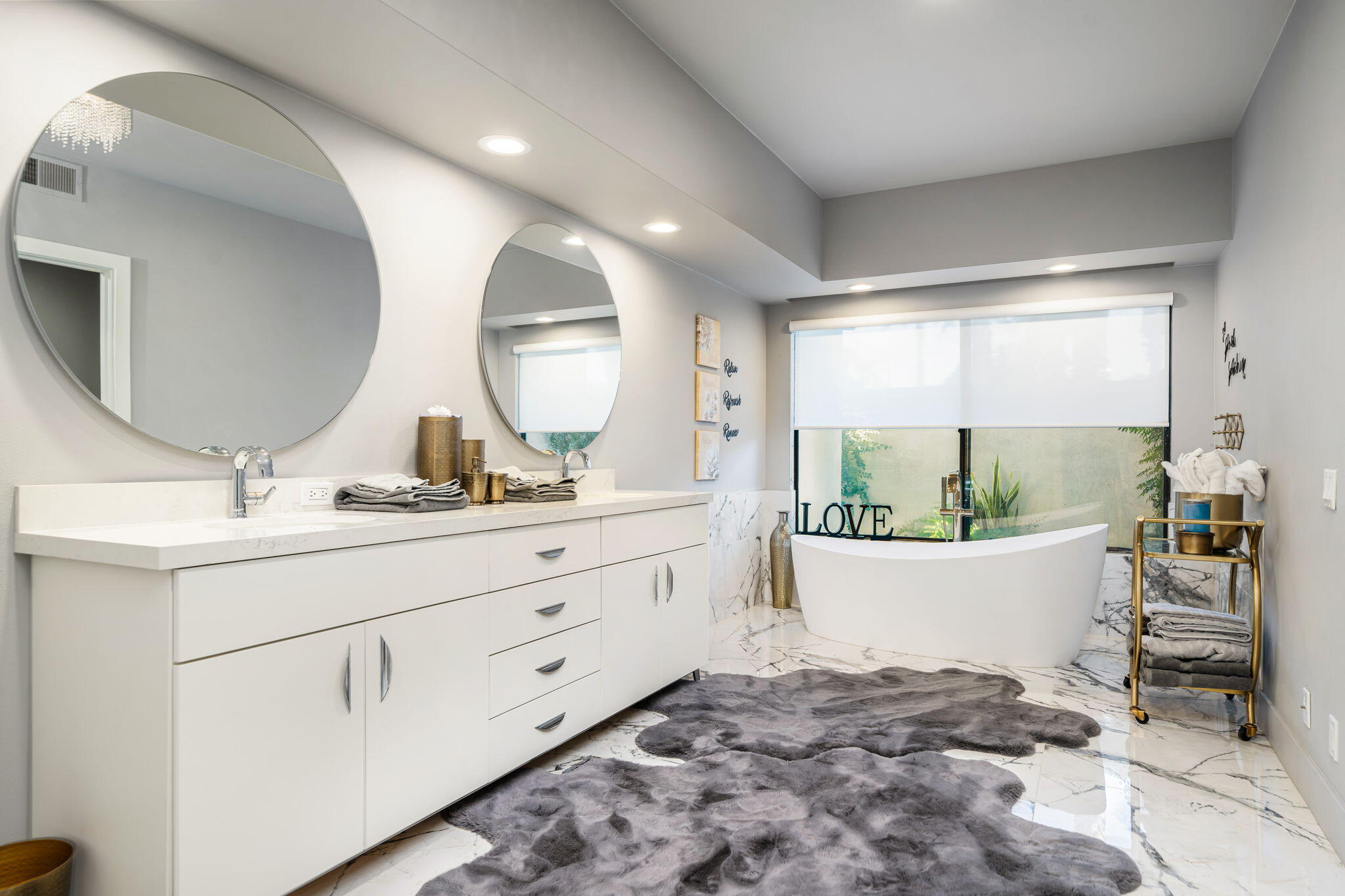 54885 Inverness Way La Quinta, CA 92253 - Photo 42 of 53 a room with sink and mirror