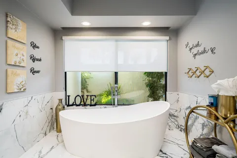 a bathroom with double vanity sinks and vanity