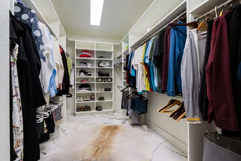 a bathroom with a shower sink and mirror