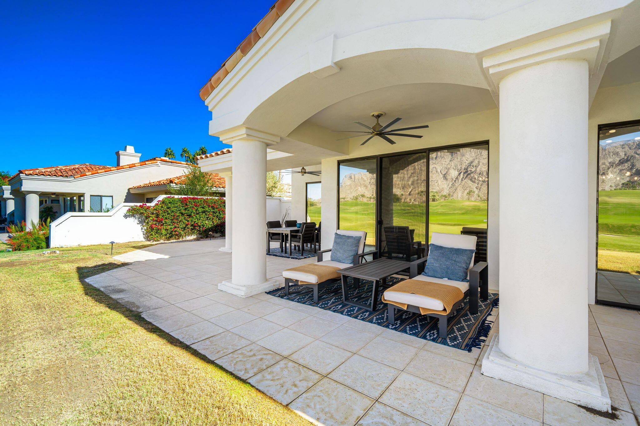 54885 Inverness Way La Quinta, CA 92253 - Photo 7 of 53 a living room with fireplace furniture and a large window