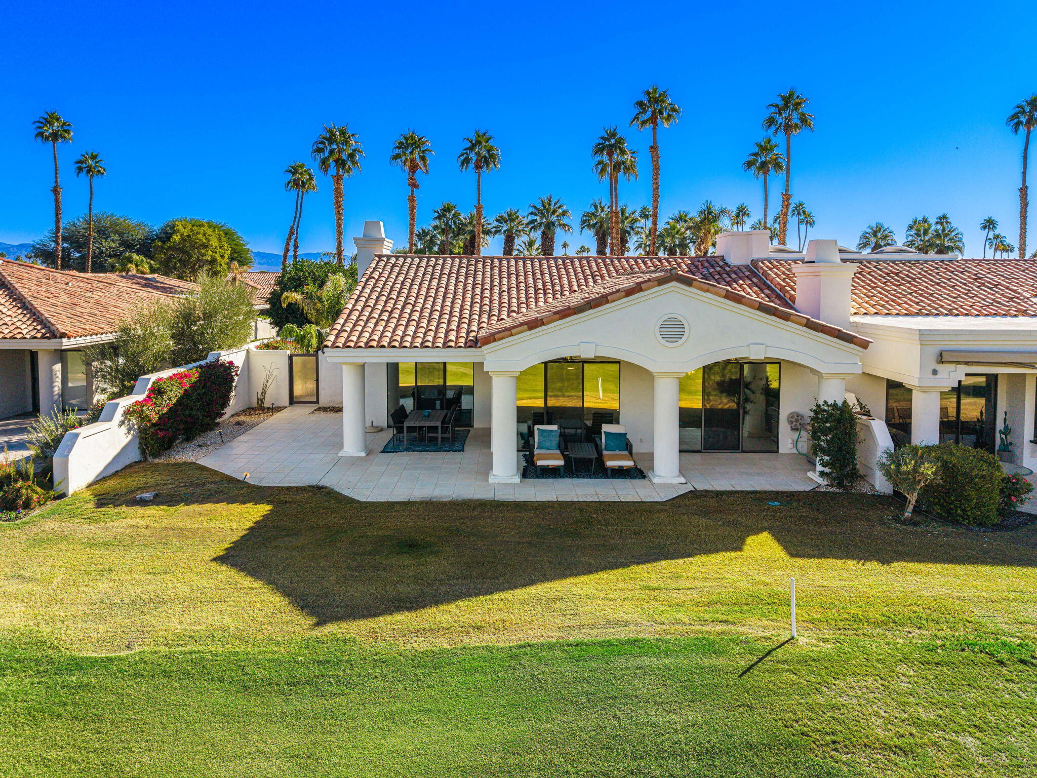 54885 Inverness Way La Quinta, CA 92253 - Photo 9 of 53 a view of a house with swimming pool and a yard