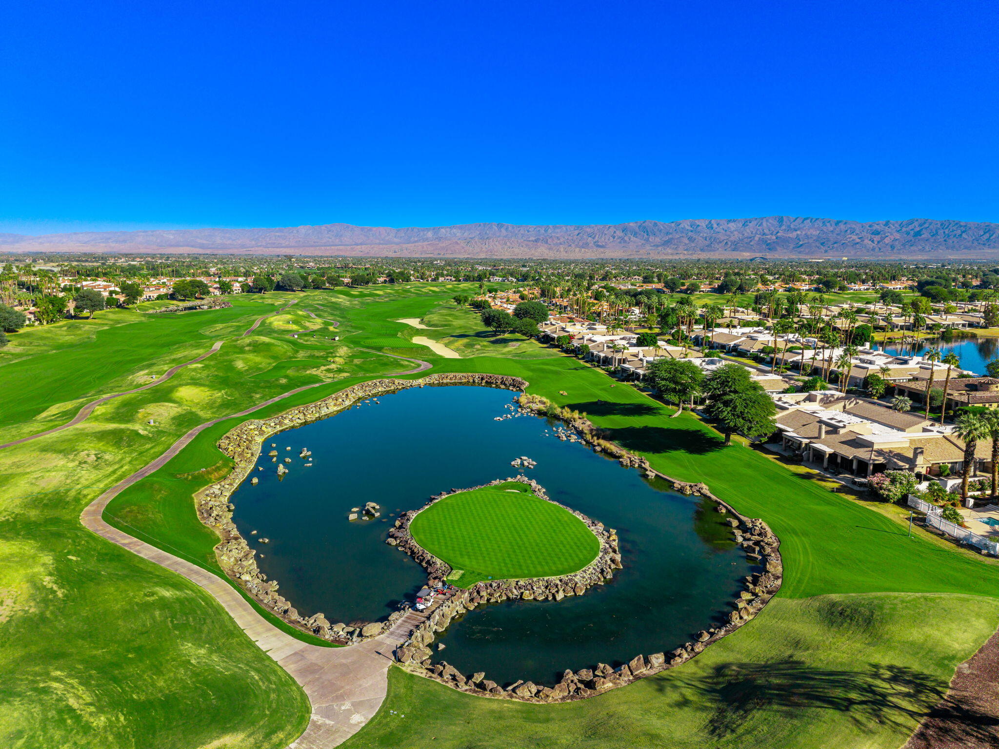54885 Inverness Way La Quinta, CA 92253 - Photo 10 of 53 an aerial view of a residential houses with outdoor space and street view