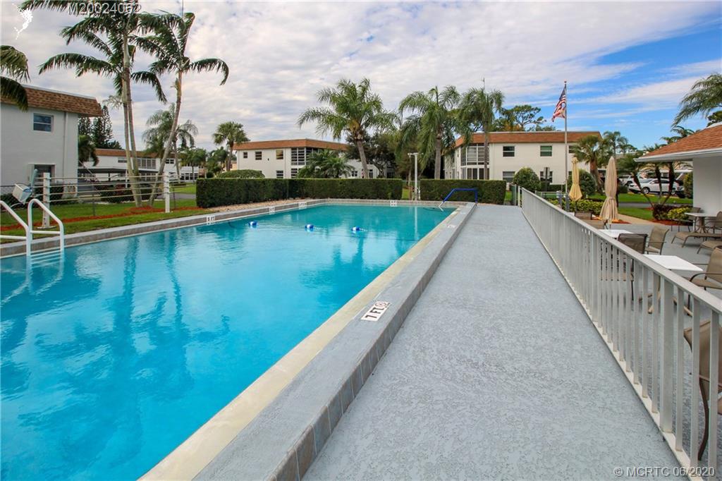 2950 Southeast Ocean Boulevard, Unit 101 Stuart, FL 34996 - Photo 26 of 29 a view of swimming pool from a balcony