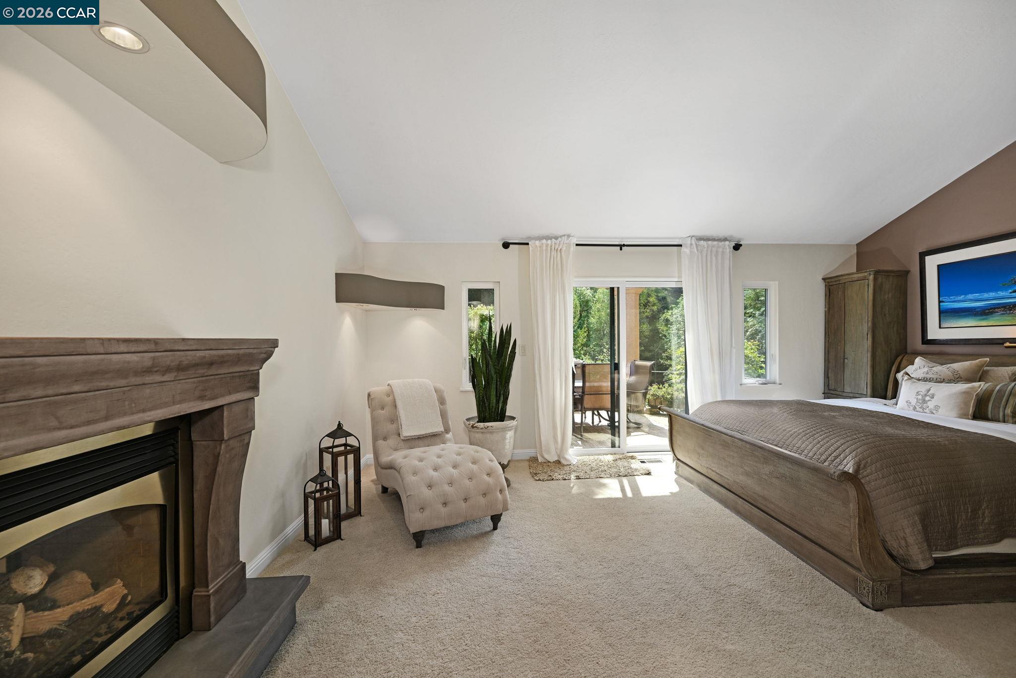 490 St Marys Road Lafayette, CA 94549 - Photo 24 of 61 a bed room with a bed and a fireplace