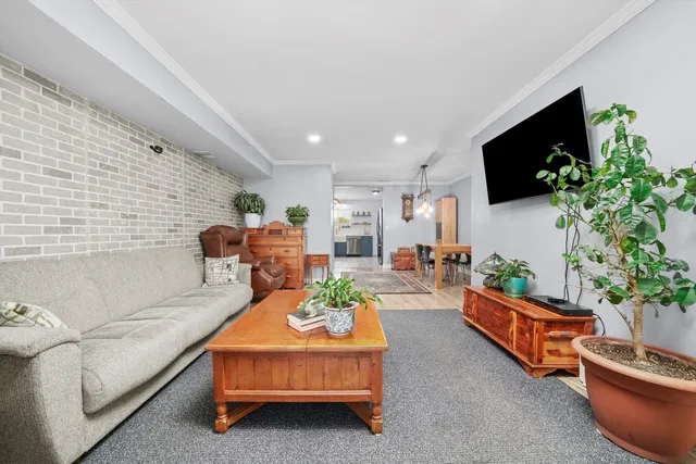 a living room with furniture fireplace and flat screen tv