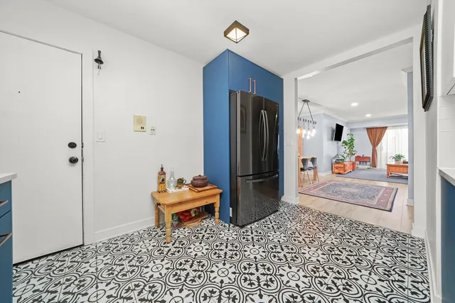 a living room with a couch and a rug