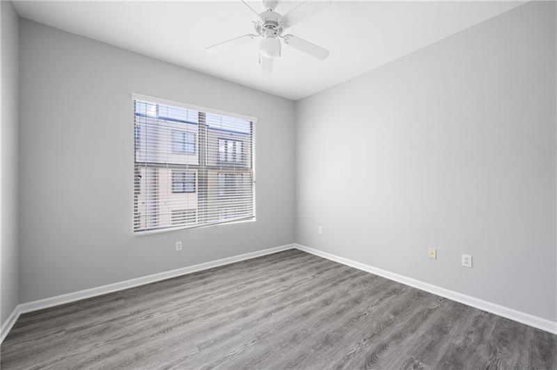 5300 Peachtree Road, Unit 2309 Chamblee, GA 30341 - Photo 18 of 44 wooden floor in an empty room with a window