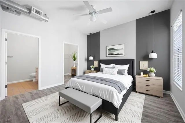 a spacious bedroom with a bed and a table