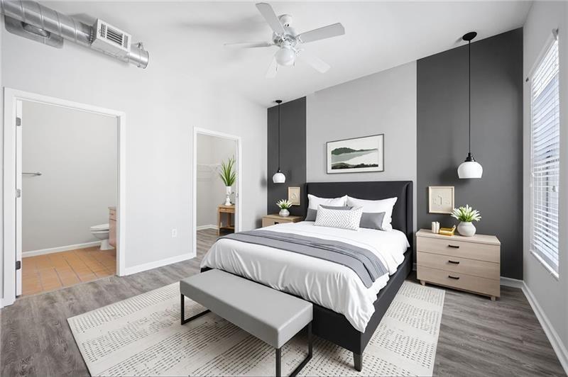 5300 Peachtree Road, Unit 2309 Chamblee, GA 30341 - Photo 21 of 44 a spacious bedroom with a bed and a table