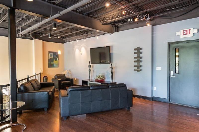 5300 Peachtree Road, Unit 2309 Chamblee, GA 30341 - Photo 28 of 44 a living room with furniture and wooden floor