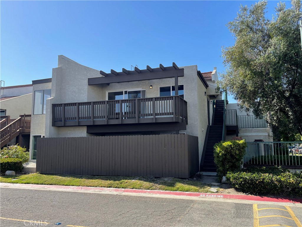 a view of a house with a garden and plants