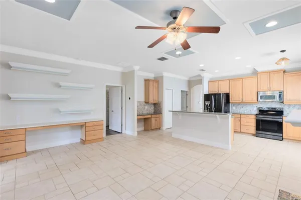 a view of a kitchen with a sink and a stove top oven
