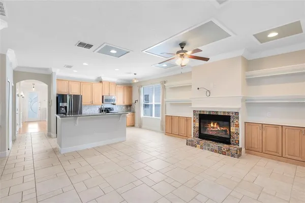 a view of a kitchen with furniture and a fireplace