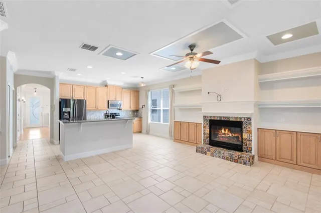 a view of a kitchen with furniture and a fireplace