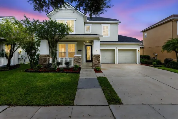 front view of a house with a yard