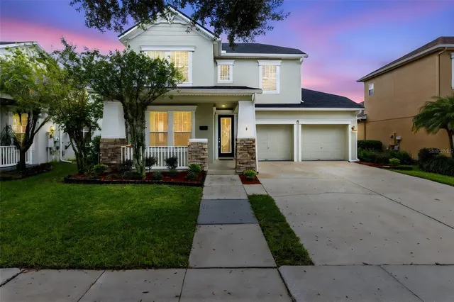 front view of a house with a yard