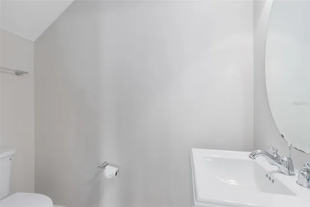 a bathroom with a sink a toilet