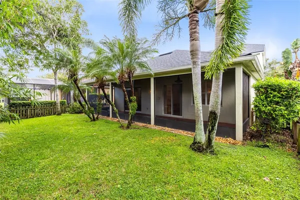 a view of a house with a yard and plants