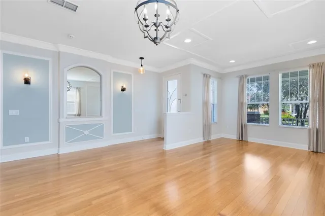 a view of an empty room and glass door