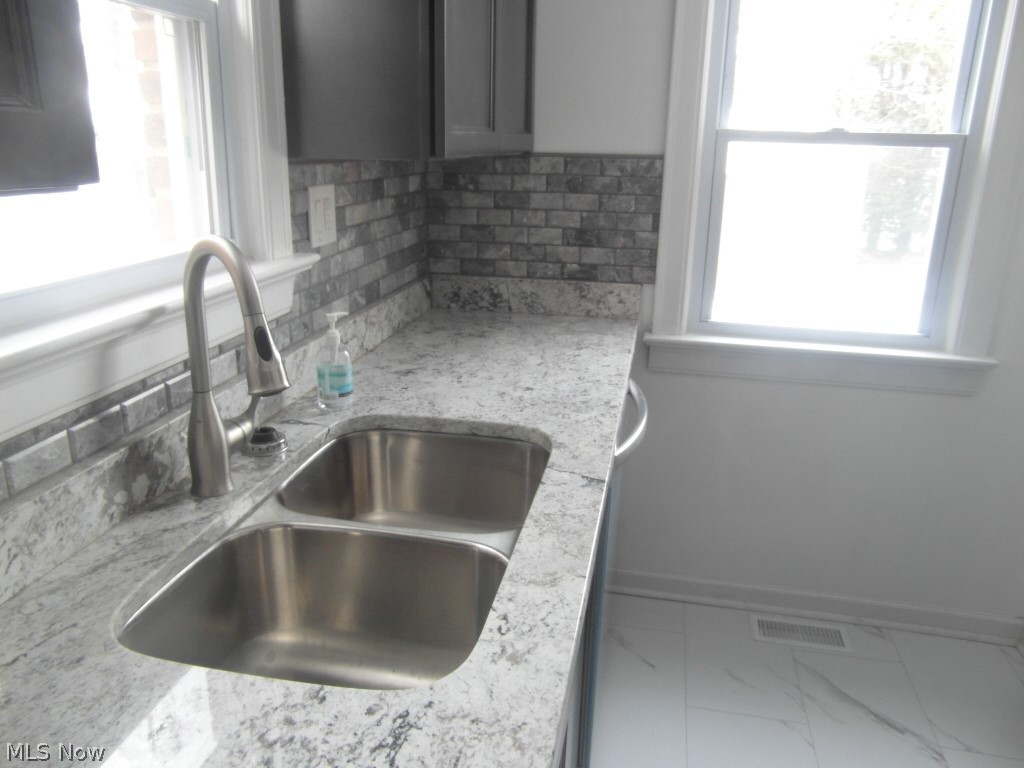 1222 Castleton Road Cleveland, OH 44121 - Photo 7 of 32 granite counter/ stainless steel sink