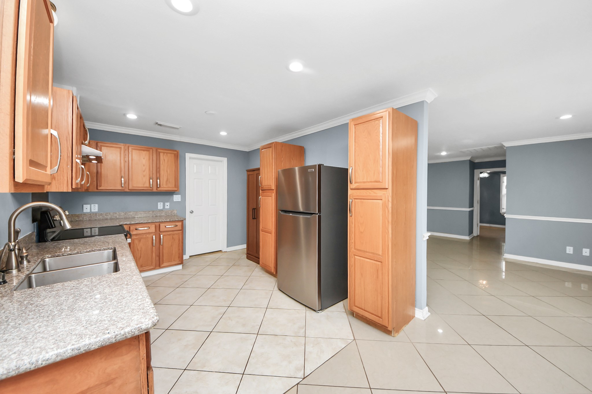 5920 Conley Street Houston, TX 77021 - Photo 16 of 38 a kitchen with stainless steel appliances granite countertop a refrigerator and a sink