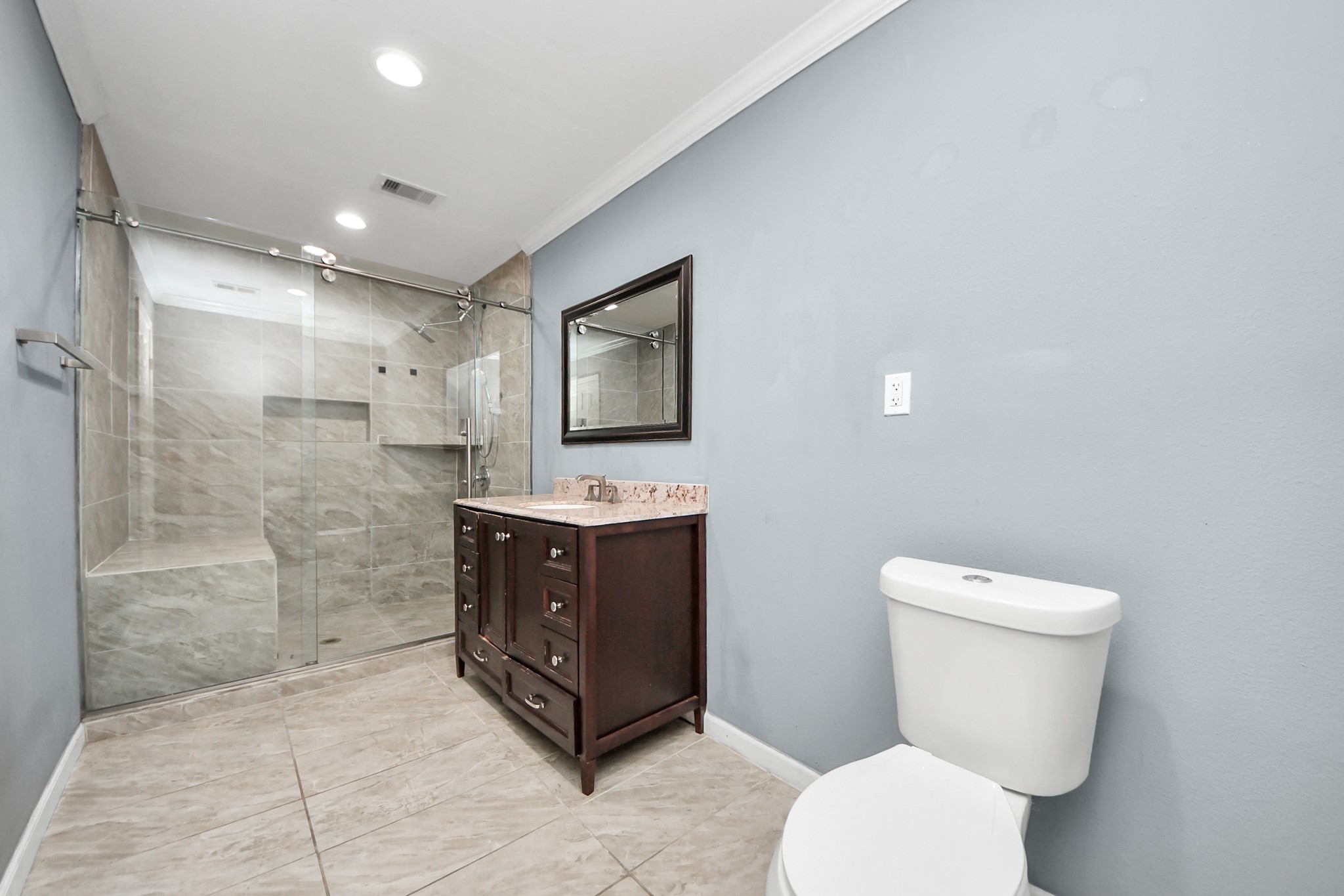 5920 Conley Street Houston, TX 77021 - Photo 3 of 38 a bathroom with a toilet sink and mirror