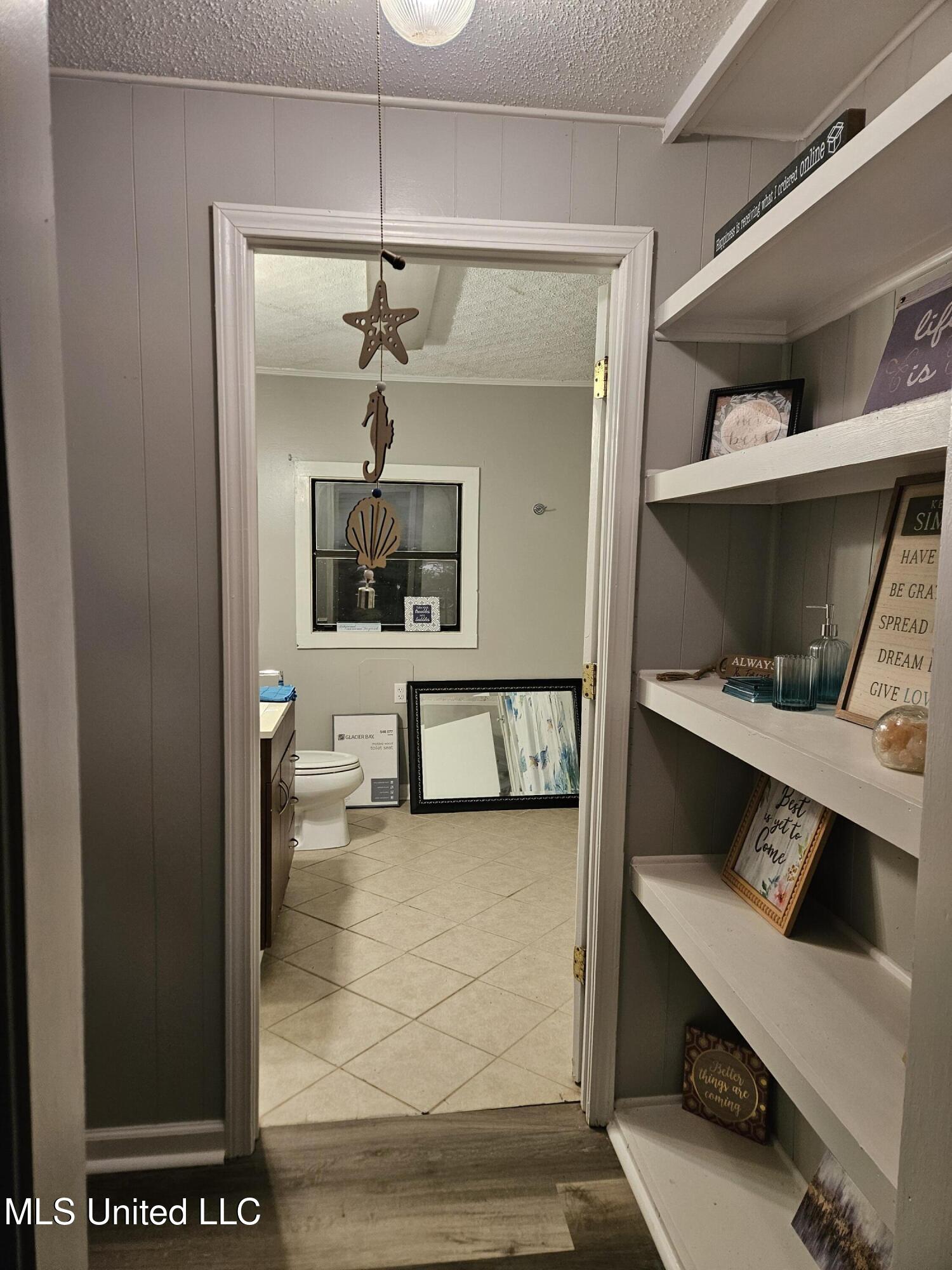 10477 Shorecrest Road Biloxi, MS 39532 - Photo 14 of 19 Hallway view into bathroom