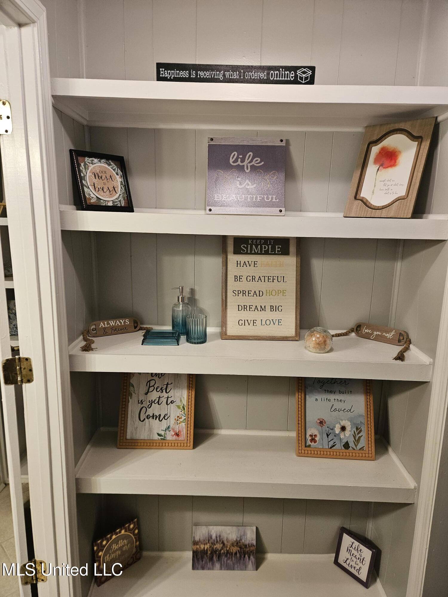 10477 Shorecrest Road Biloxi, MS 39532 - Photo 15 of 19 Hallway built in shelving