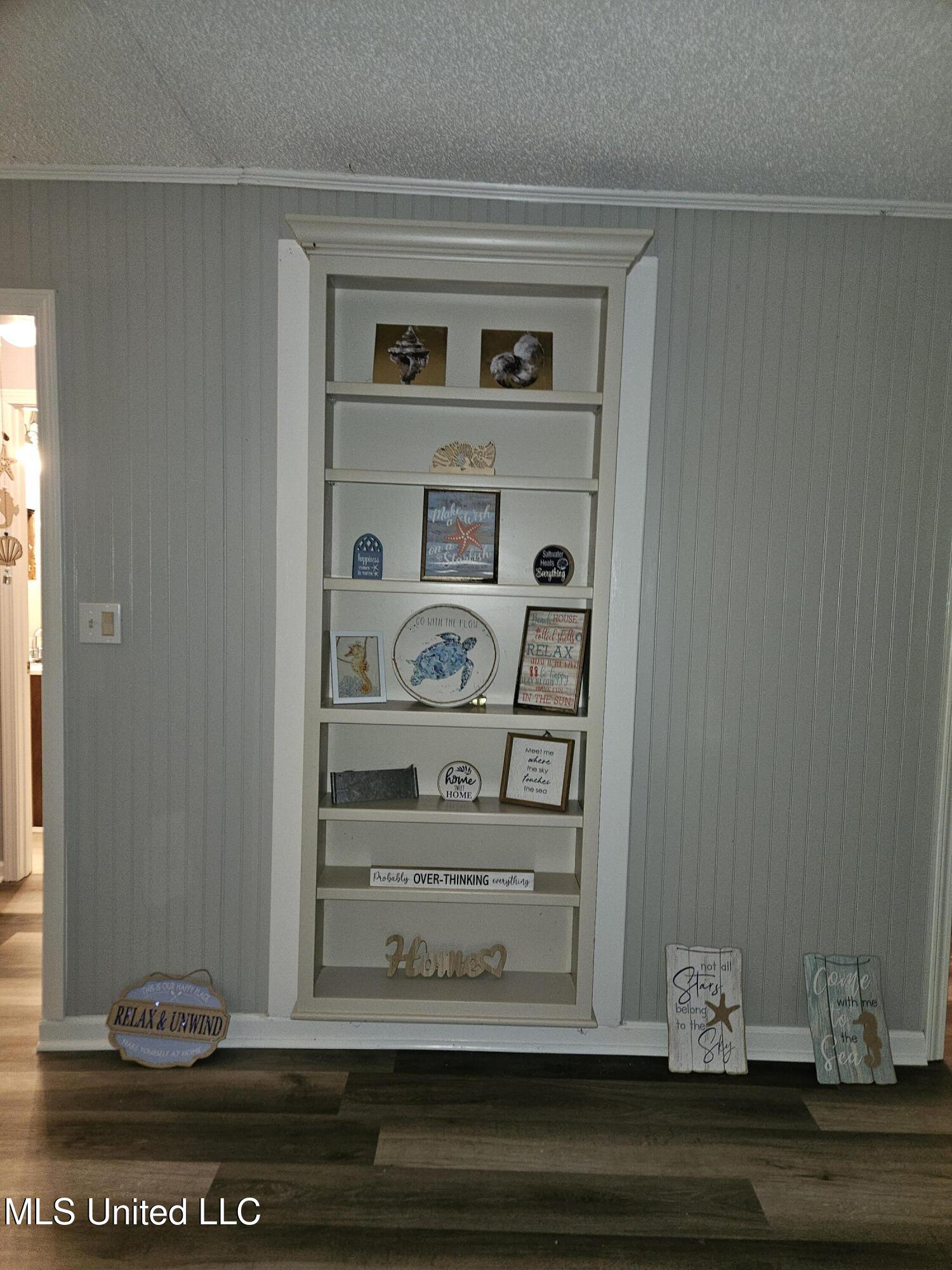 10477 Shorecrest Road Biloxi, MS 39532 - Photo 9 of 19 Living room built in shelfing