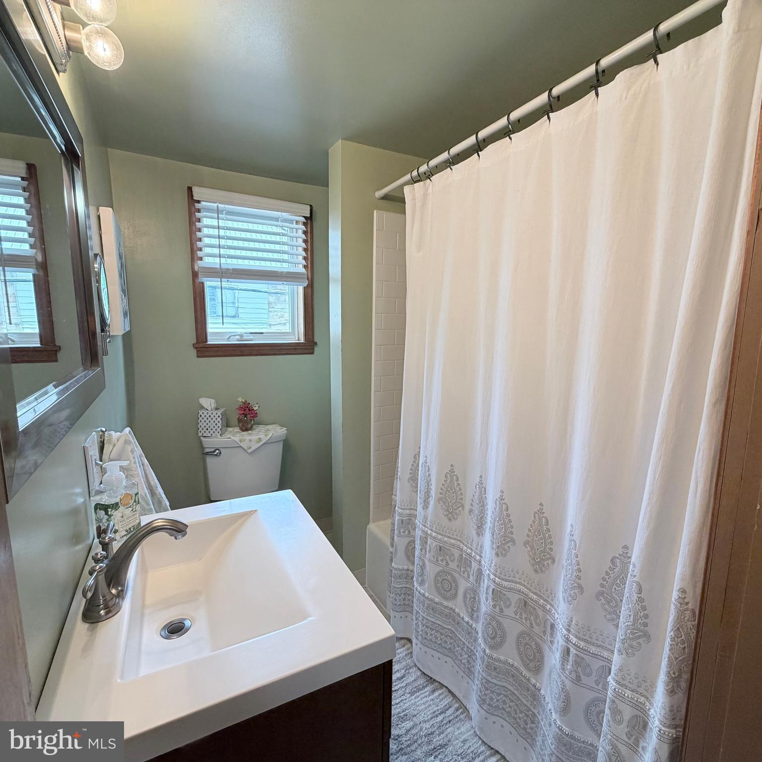 12997 Main Street Fort Loudon, PA 17224 - Photo 37 of 48 a bathroom with a sink and a mirror
