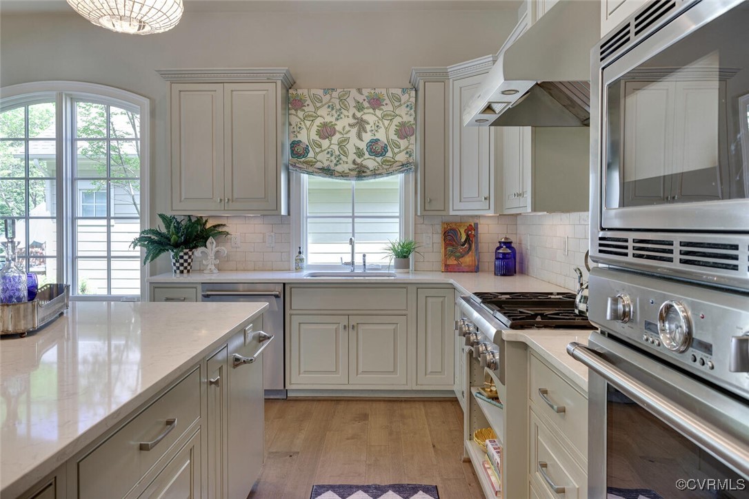 2392 Bel Crest Circle Midlothian, VA 23113 - Photo 13 of 50 a kitchen with a sink stove top oven and cabinets