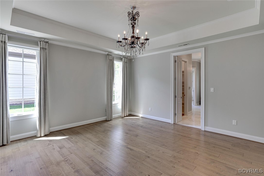 2392 Bel Crest Circle Midlothian, VA 23113 - Photo 18 of 50 a view of an empty room with window and wooden floor