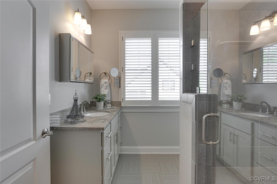 2392 Bel Crest Circle Midlothian, VA 23113 - Photo 32 of 50 a bathroom with a granite countertop sink and a mirror