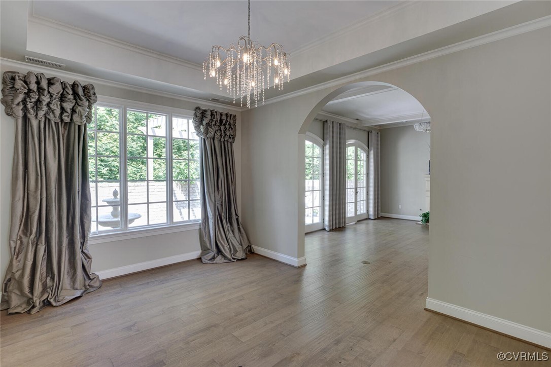 2392 Bel Crest Circle Midlothian, VA 23113 - Photo 8 of 50 a view of a livingroom with a chandelier curtains and large windows