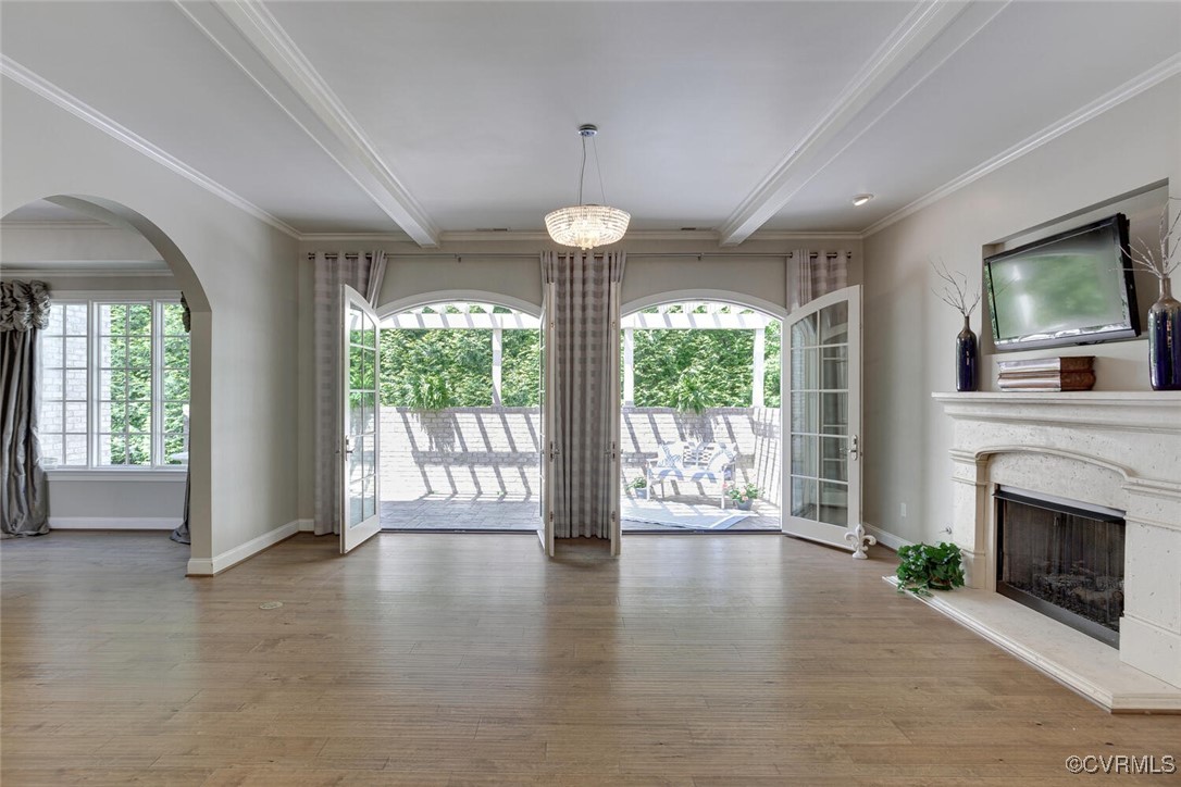 2392 Bel Crest Circle Midlothian, VA 23113 - Photo 9 of 50 a view of an empty room with wooden floor and a fireplace