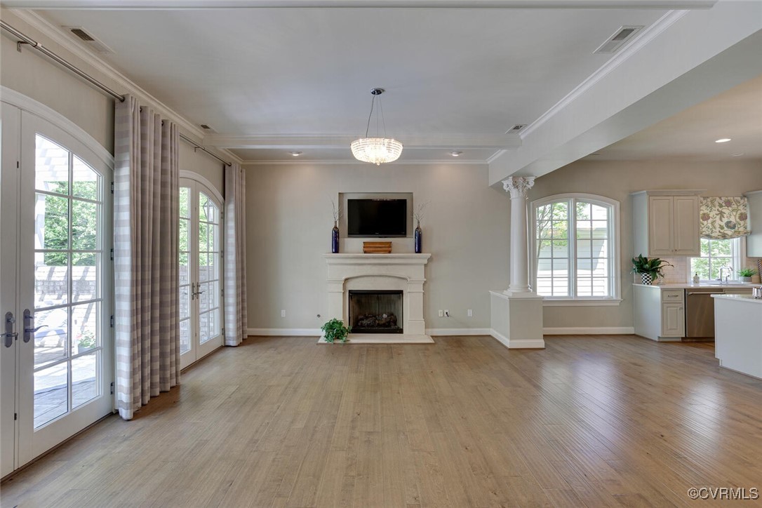 2392 Bel Crest Circle Midlothian, VA 23113 - Photo 10 of 50 a view of a livingroom with a fireplace wooden floor and windows