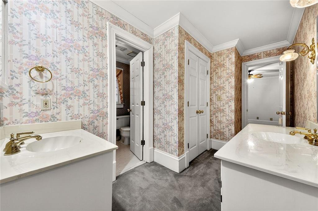 5523 Bahia Mar Circle Smoke Rise, GA 30087 - Photo 23 of 69 a bathroom with a sink and a mirror