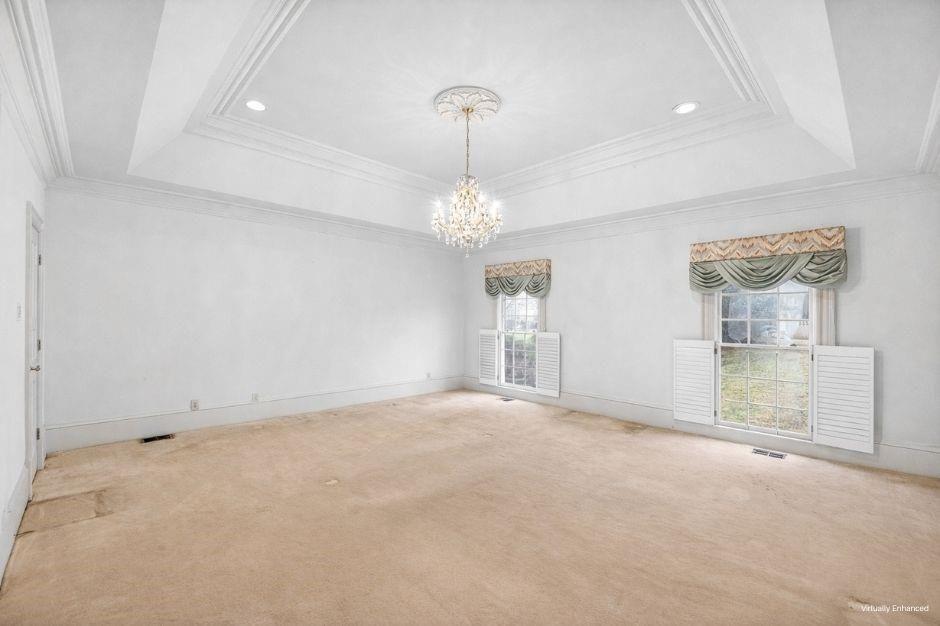 5523 Bahia Mar Circle Smoke Rise, GA 30087 - Photo 26 of 69 en empty room with windows and chandelier