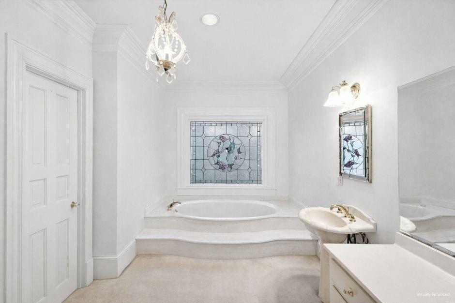 5523 Bahia Mar Circle Smoke Rise, GA 30087 - Photo 29 of 69 a bathroom with a bathtub and a shower