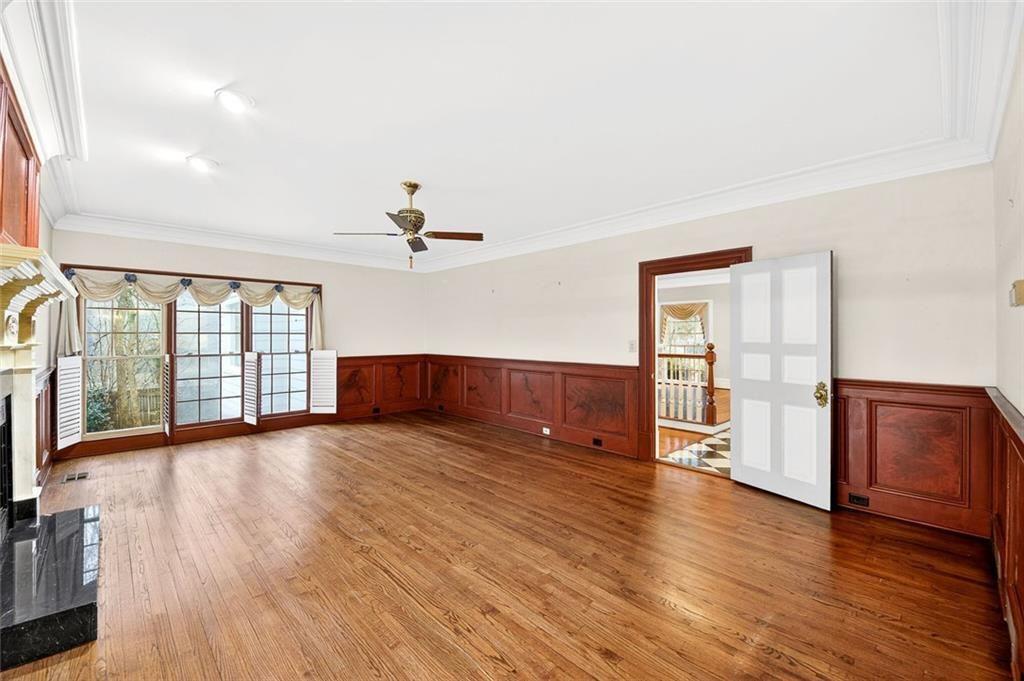 5523 Bahia Mar Circle Smoke Rise, GA 30087 - Photo 37 of 69 a view of an empty room with wooden floor and a window