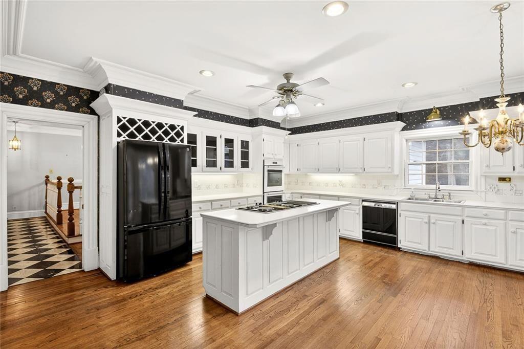5523 Bahia Mar Circle Smoke Rise, GA 30087 - Photo 45 of 69 a kitchen with stainless steel appliances granite countertop a stove and a refrigerator