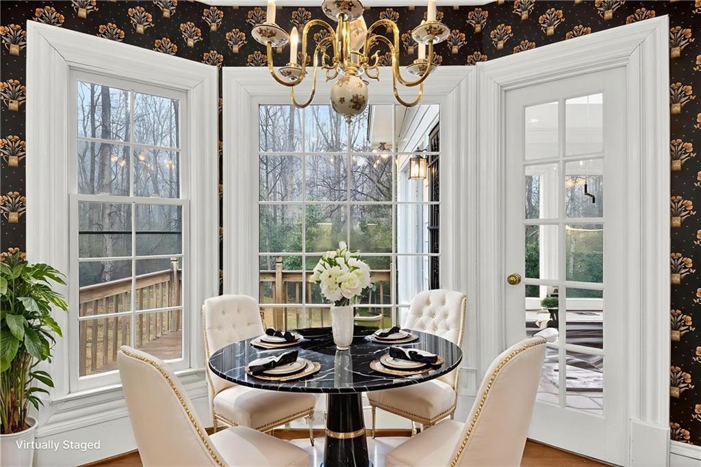 5523 Bahia Mar Circle Smoke Rise, GA 30087 - Photo 50 of 69 a dining room with furniture and window